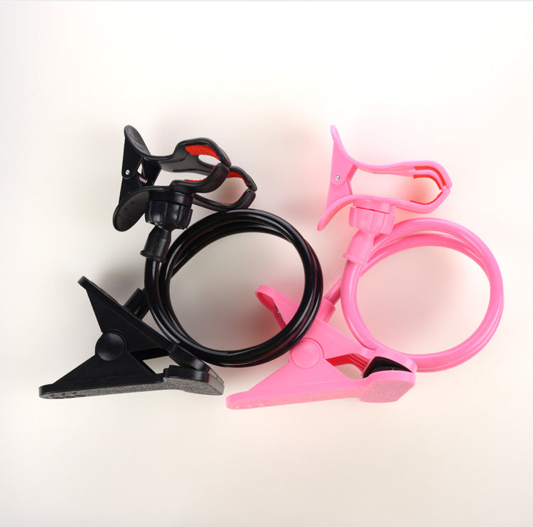 Black and pink clamps with cables on a white background